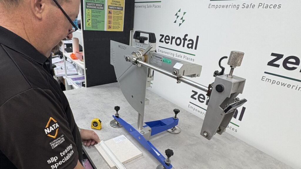 Technician conducting slip resistance test on tile sample – Zerofal laboratory.