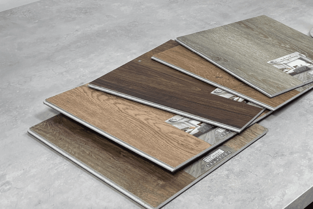 Technician preparing tile samples for slip resistance testing in lab.