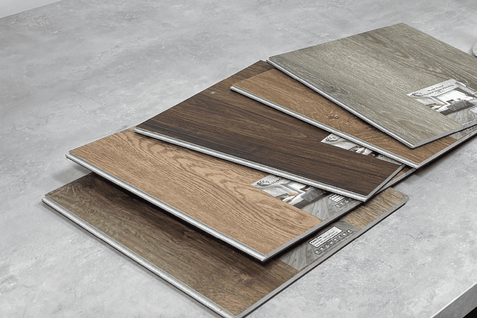 Technician preparing tile samples for slip resistance testing in lab.