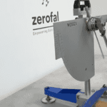 Tile sample undergoing wet pendulum slip resistance testing in laboratory using Wessex Portable Skid Resistance Tester with red base