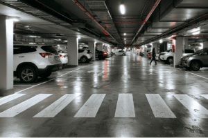 One Product, Two Results: How Coatings Can Change Your P-Rating 1 Underground shopping centre car park showing pedestrian crossing and damp floor conditions highlighting slip risk